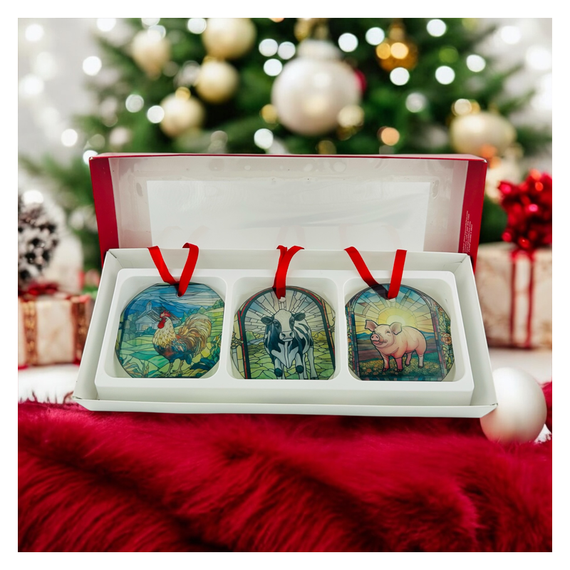 gift box of 3 stain glass looking ornaments with farm animals, rooster, cow, and pig