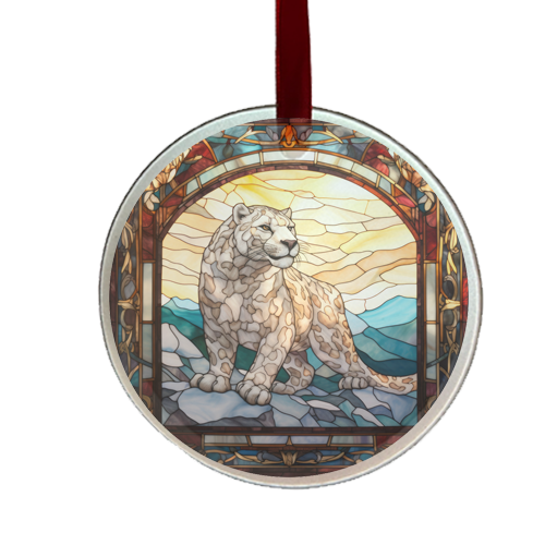 A round glass ornament featuring a stained glass window-like design with a snow leopard motif in the center, set against a red ribbon.