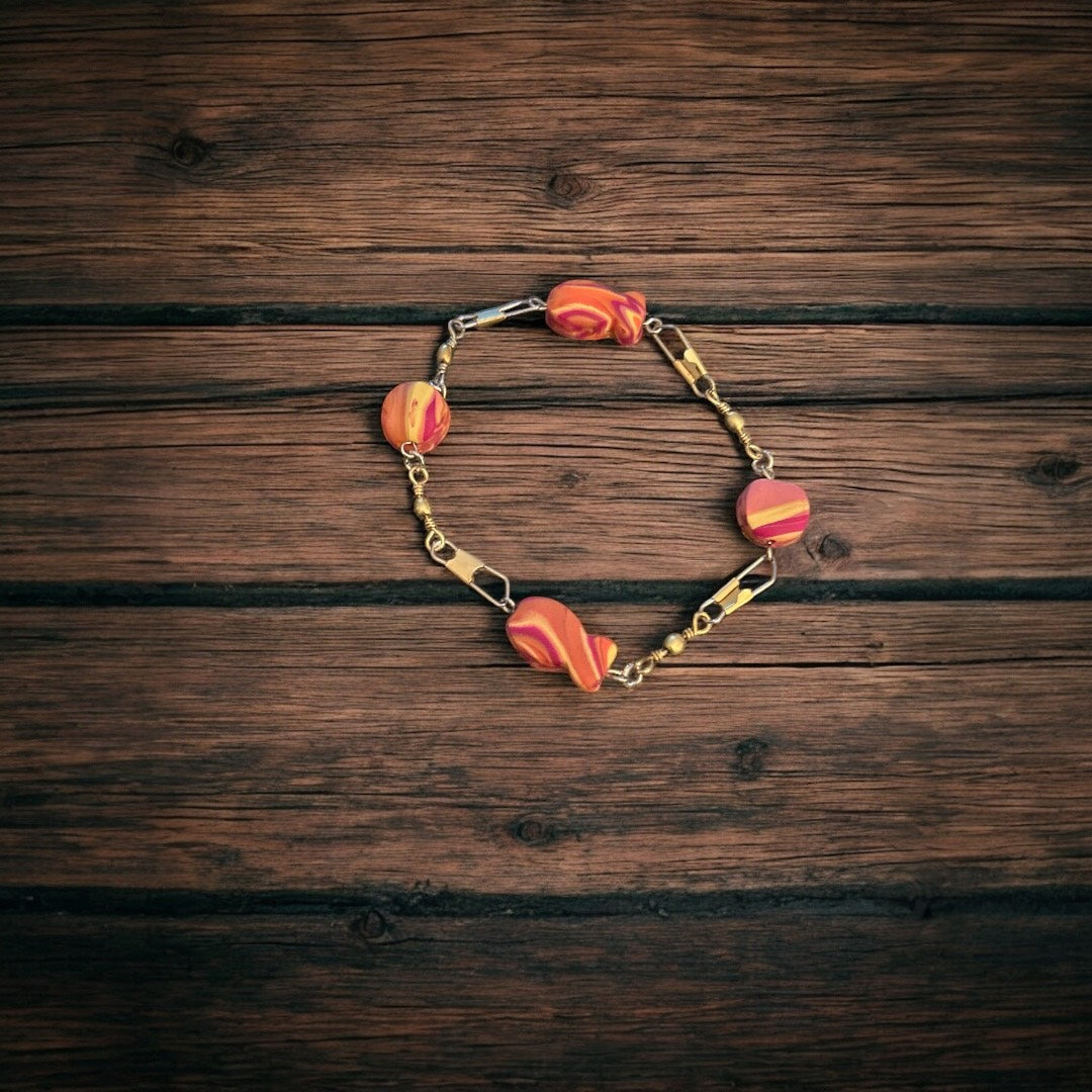 Bracelet with colorful goldfish beads on a wooden surface