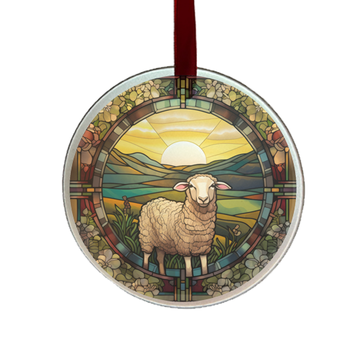 a stain glass round ornament with sheep and field with sun behind