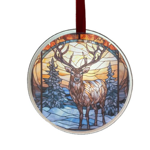 A round glass ornament featuring a stained glass design of a stag with a forest and sunset background, hanging from a red ribbon.