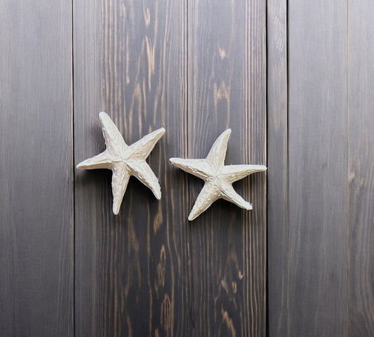 White Starfish earrings made from polymer clay.
