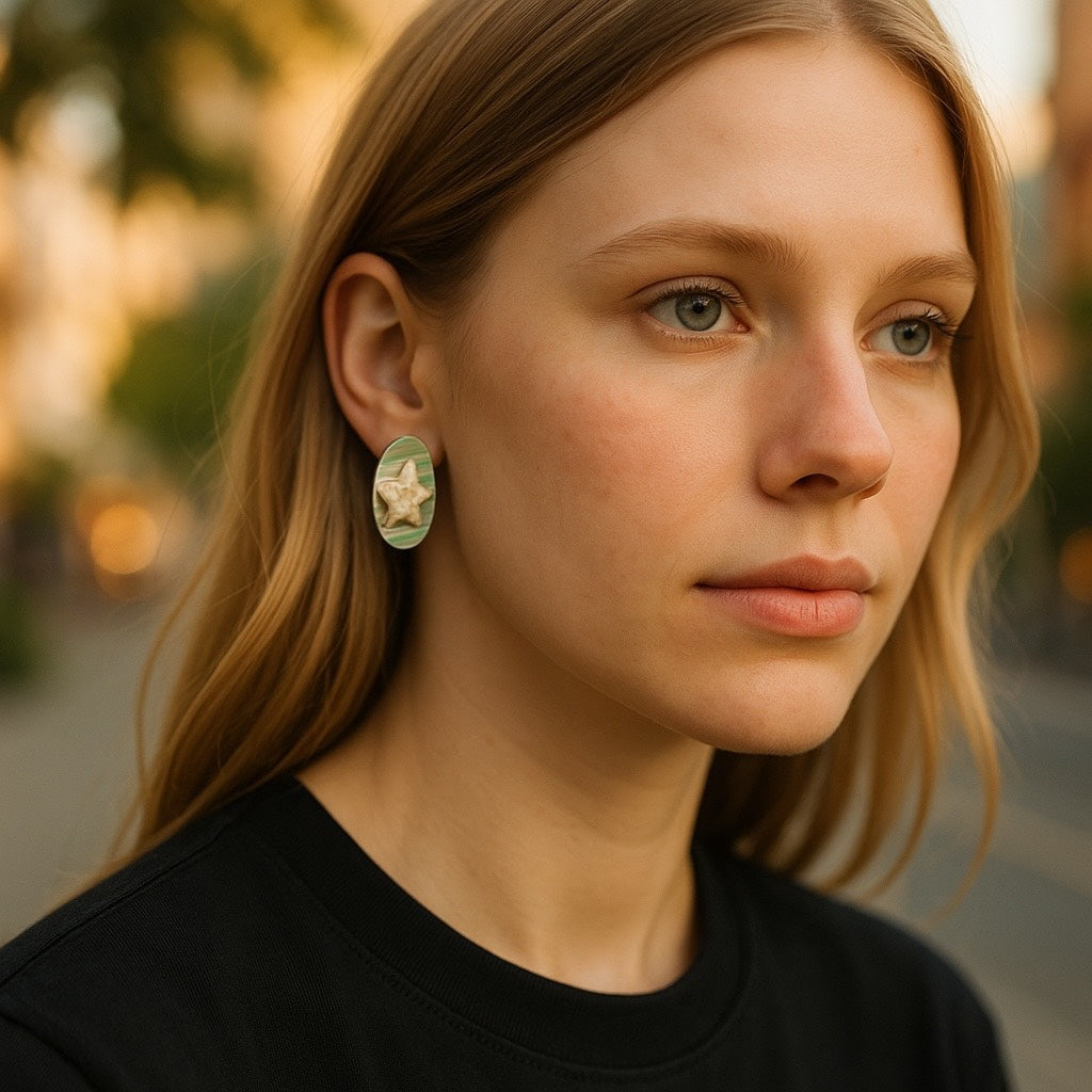 Close-up of a woman wearing earrings with a blurred outdoor background