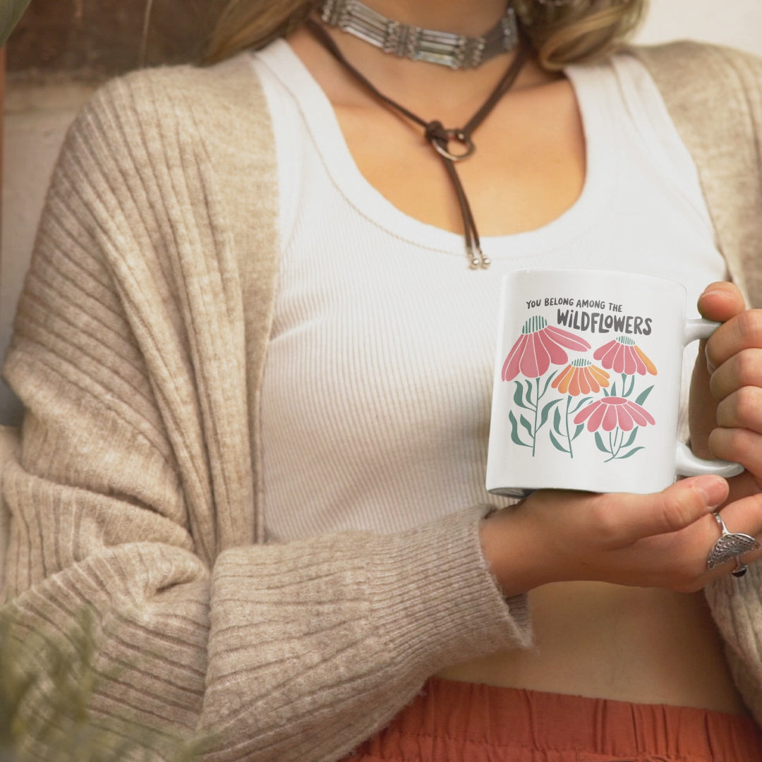 short video of woman holding boho mug with flowers