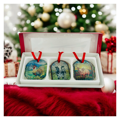 gift box of 3 stain glass looking ornaments with farm animals, rooster, cow, and pig