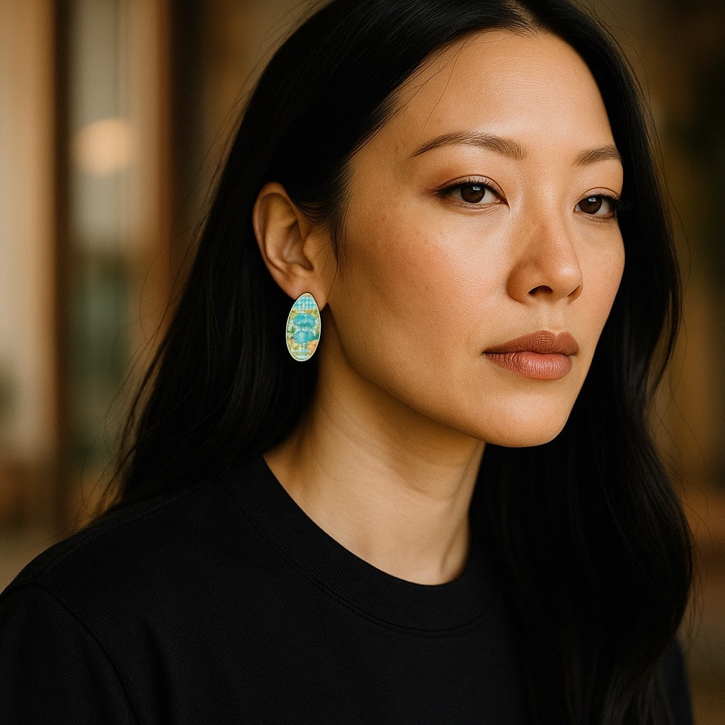 Woman wearing colorful earrings with a blurred background