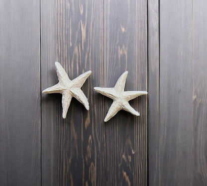 White Starfish earrings made from polymer clay. 